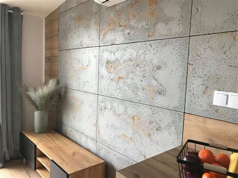 Wielkoformatowe płyty gresowe imitujące beton architektoniczny w nowoczesnym wiatrołapie