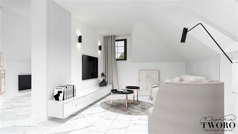 Minimalistyczny salon z białymi meblami i geometrycznymi dodatkami